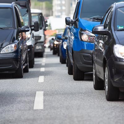 Vans and cars on a road in the UK